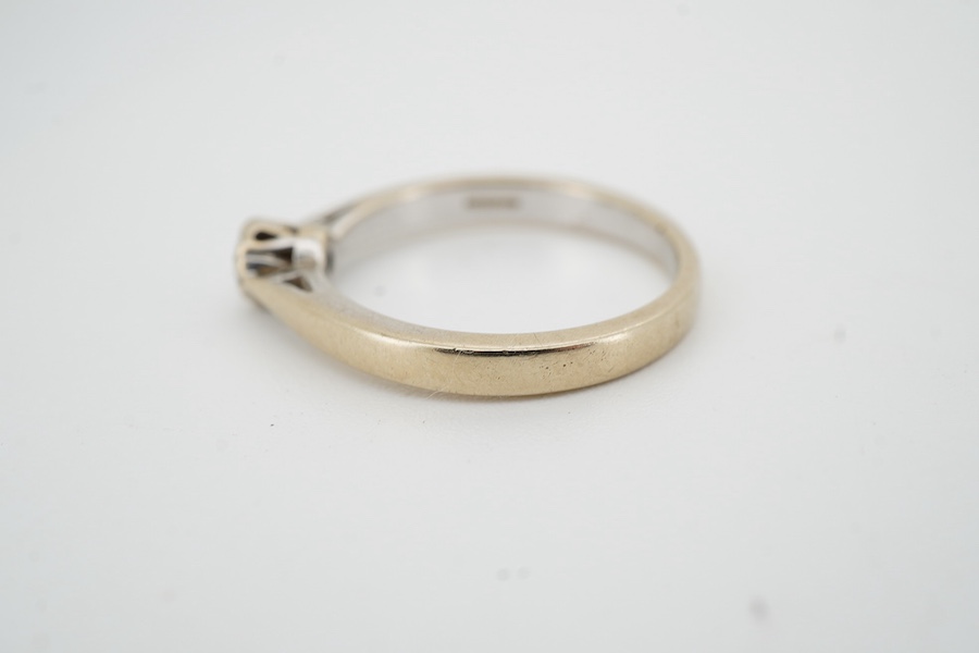 A diamond solitaire ring, claw-set with a brilliant-cut diamond weighing approximately 0.15 carats, mounted in 18ct gold, size N, British hallmarks, gross weight approximately 3 grams